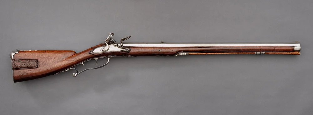 The picture shows a flintlock rifle, a historical European muzzle-loading firearm.